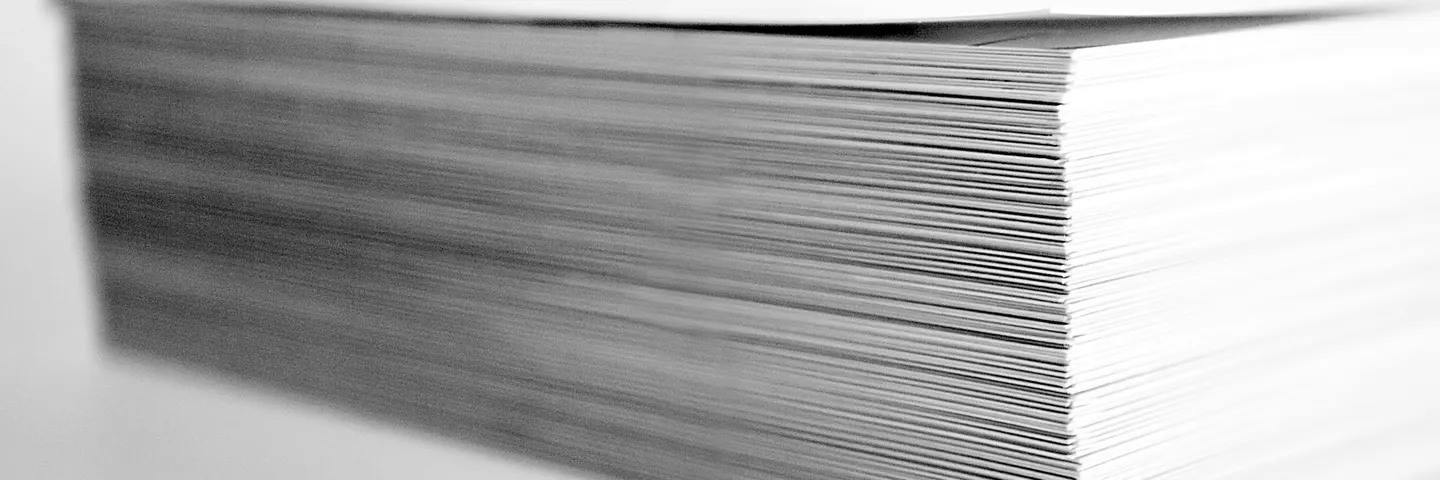 A neatly cut stack of paper